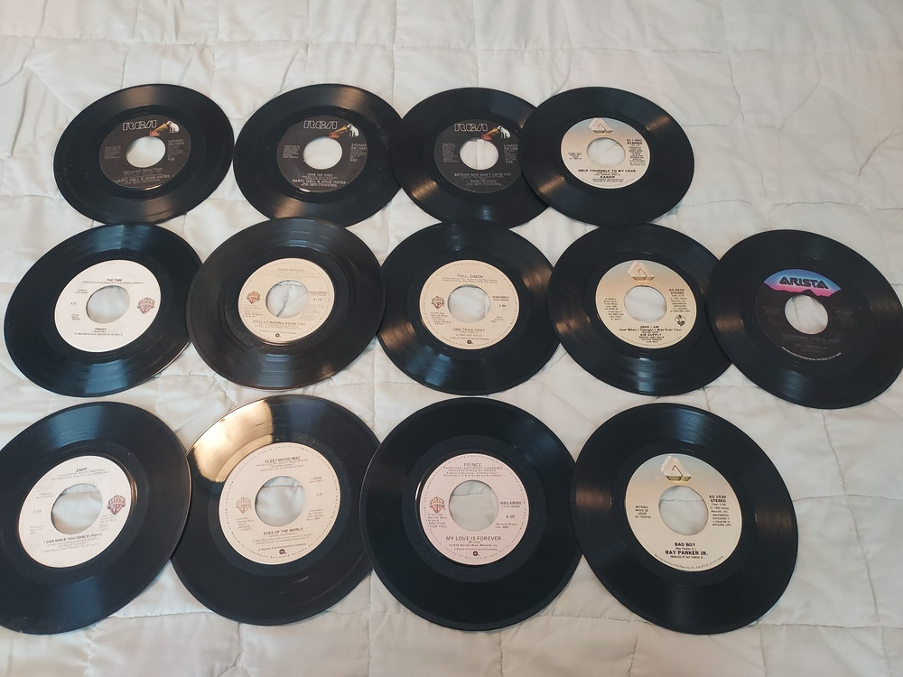 Lot Of 13 Vinyl Records 45 rpm Arista and Warner Bros Prince Ray Parker Jr Simon